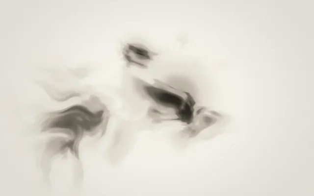 Wisps of gray ink drift across cream paper, gathering into darker swirls near the center.